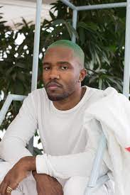 frank ocean sitting with his green hair